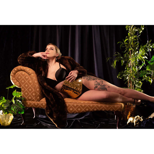 gold pvc corset editorial shoot fur coat chaise lounge - corsets island