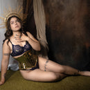 gold underbust corset styled shoot seated pose - corsets island